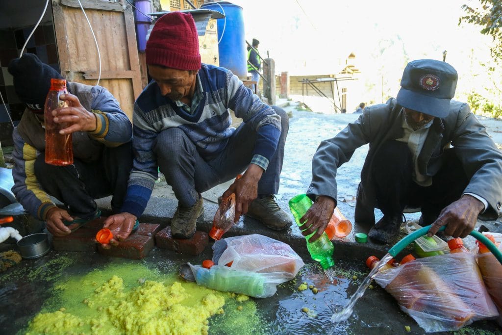 Bottles filled with khichdi meant for trapped workers being emptied | Suraj Singh Bisht | ThePrint