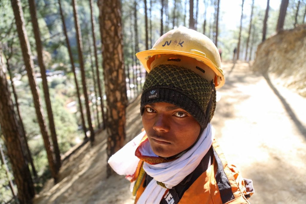A worker part of crew constructing road on hill above tunnel | Suraj Singh Bisht | ThePrint