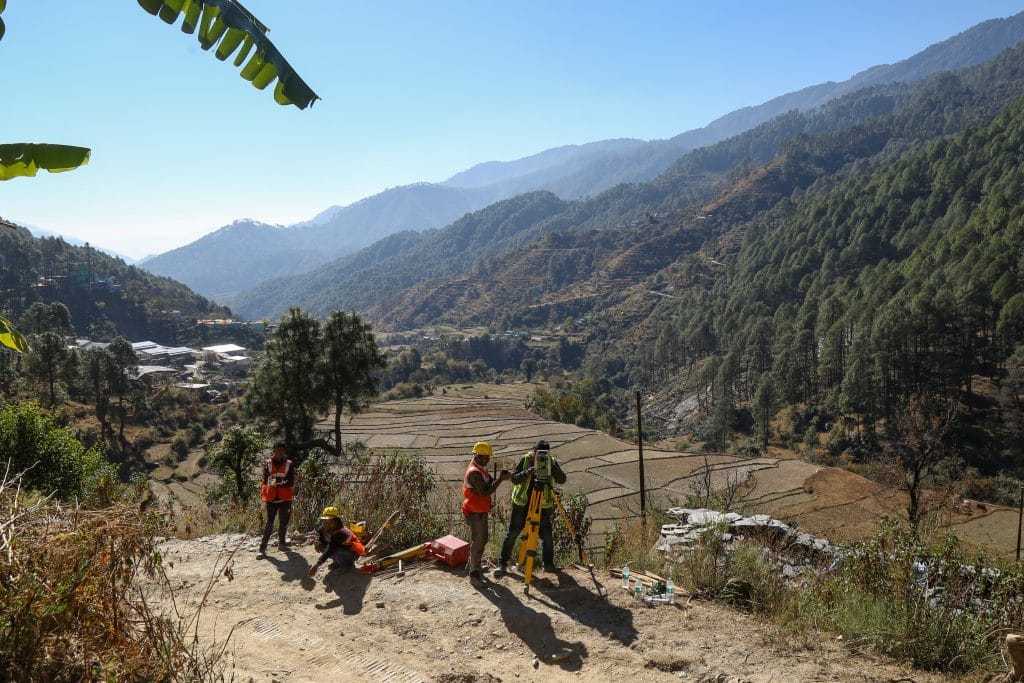 An engineer using geodetic measuring devices to survey geographical features of hill above tunnel | Suraj Singh Bisht | ThePrint